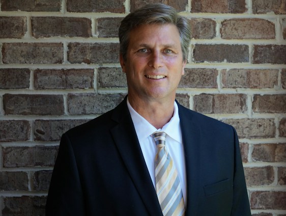 portrait photography of man wearing black suit jacket